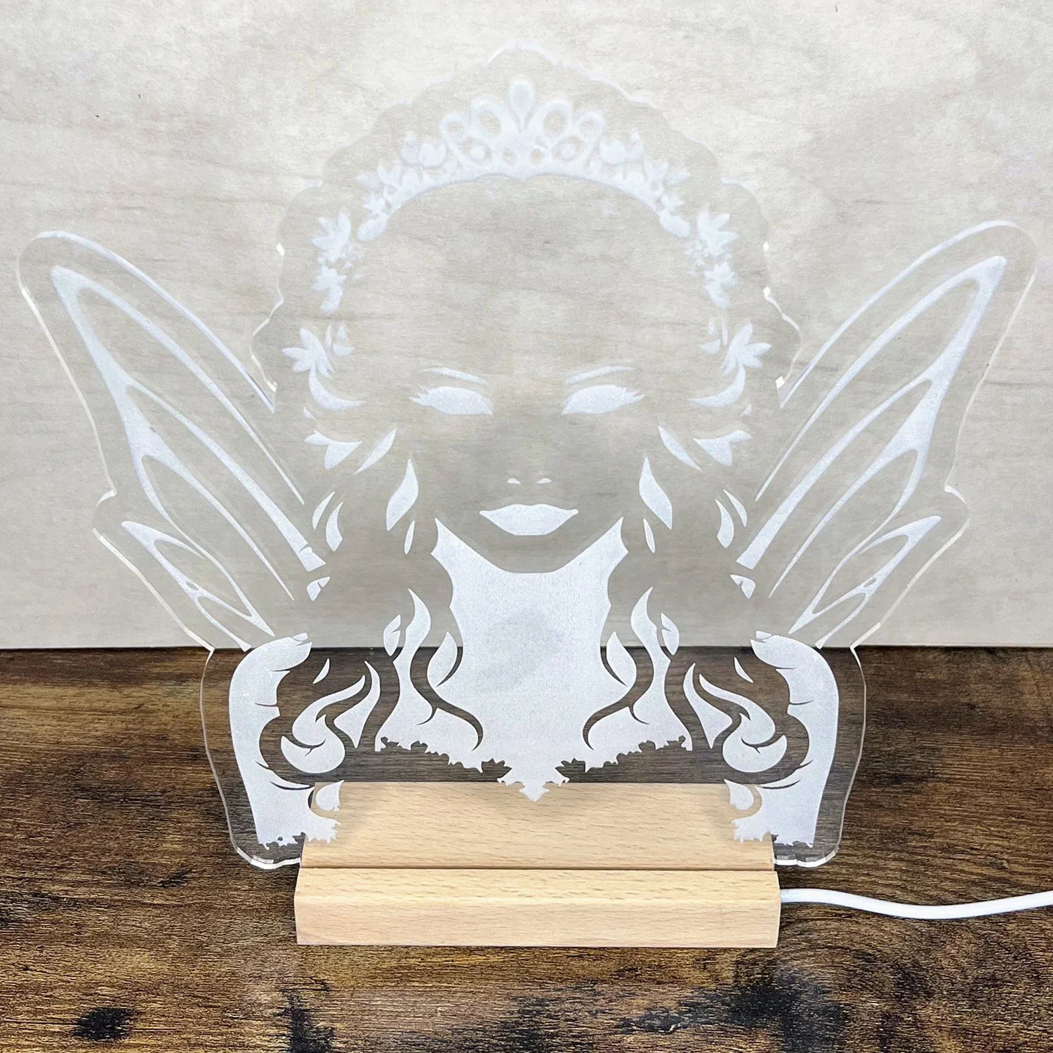 Fairy Queen LED Nightlight with acrylic design on wooden base.