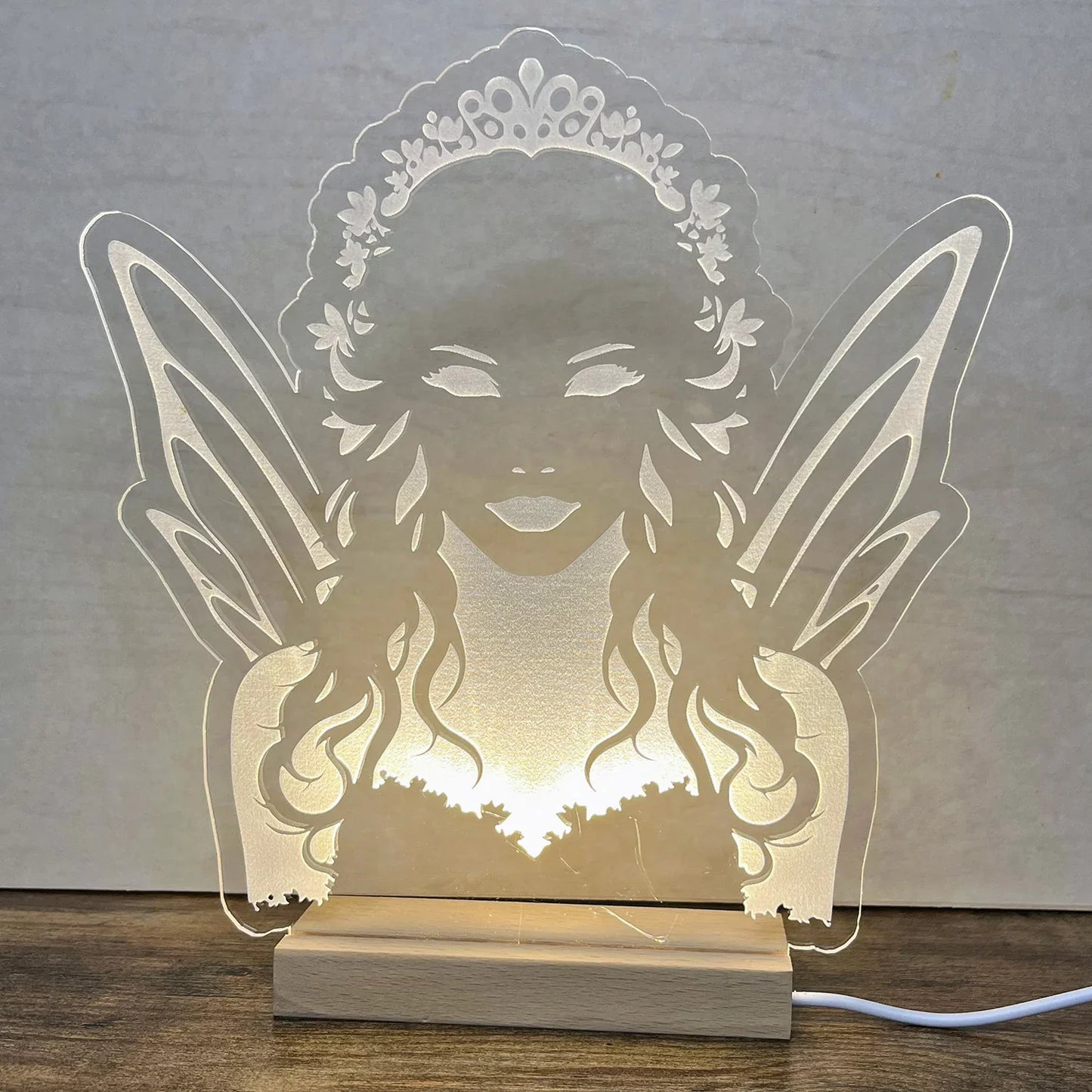 Fairy Queen LED Nightlight with acrylic design illuminating softly.