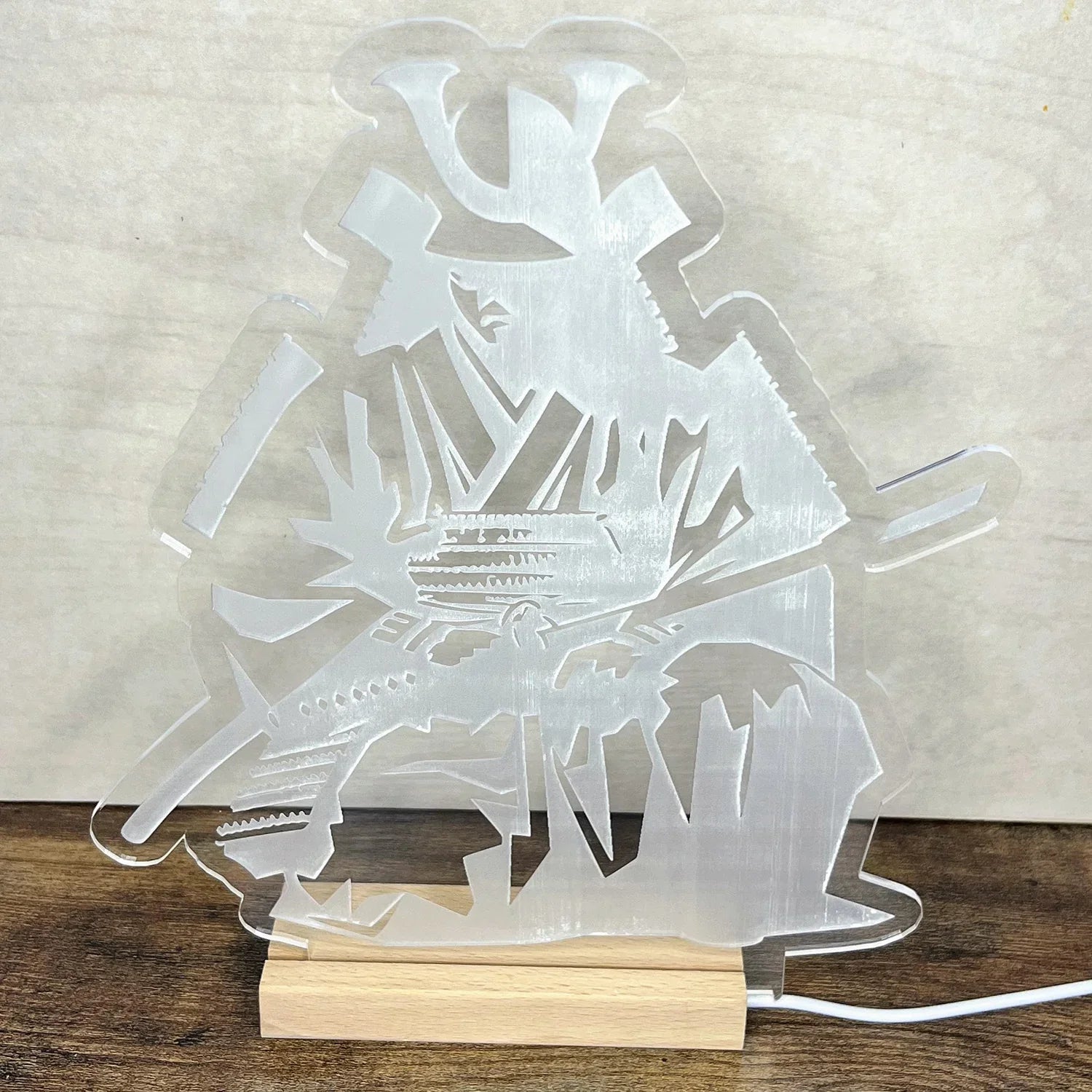 Samurai LED Nightlight depicting a samurai warrior silhouette on a wooden base.