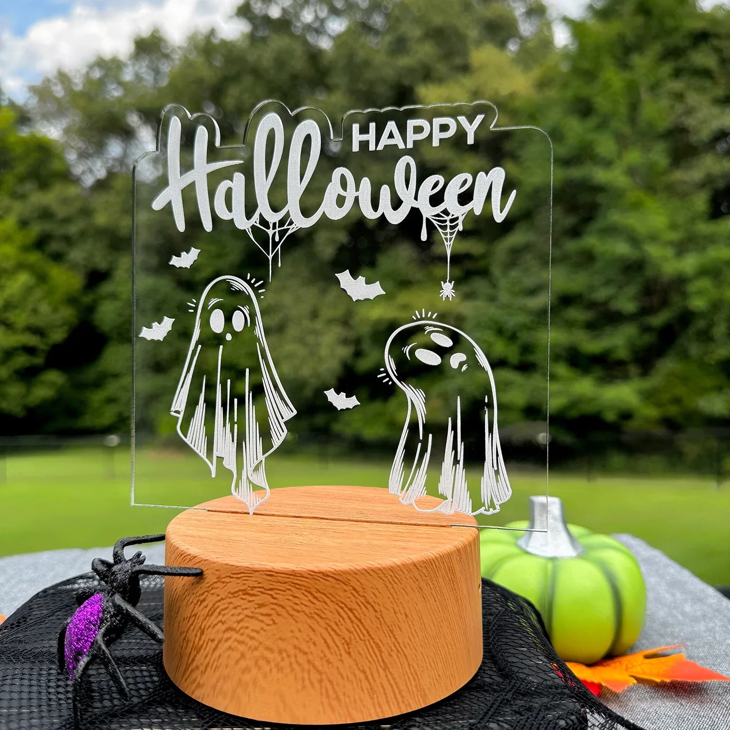 Adorable Ghosts "Happy Halloween" LED Nightlight with acrylic light insert and intricate design.