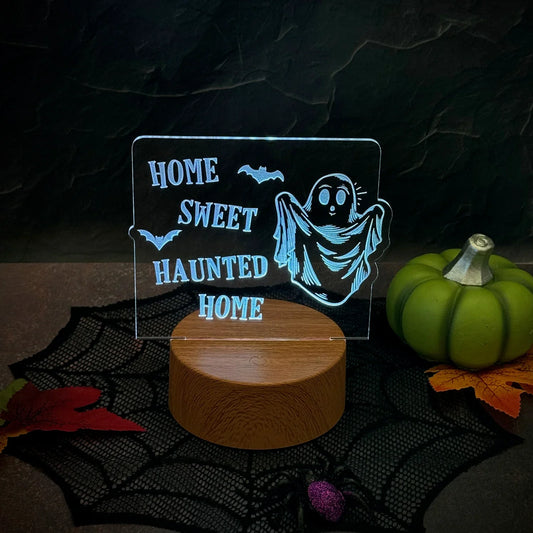 Home Sweet Haunted Home Halloween LED nightlight with ghost design on acrylic insert.