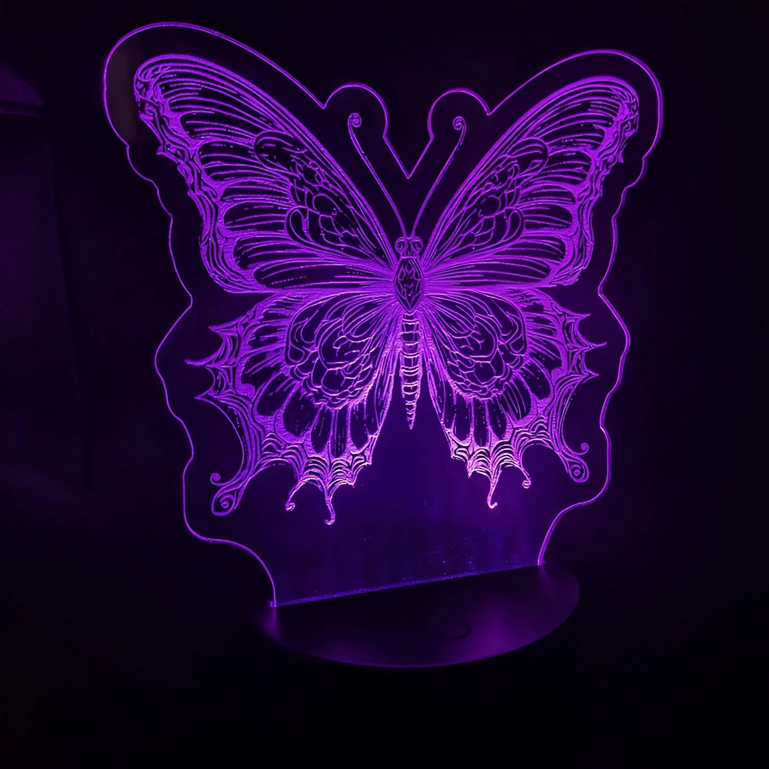 Magnificent Butterfly LED Nightlight glowing in purple.