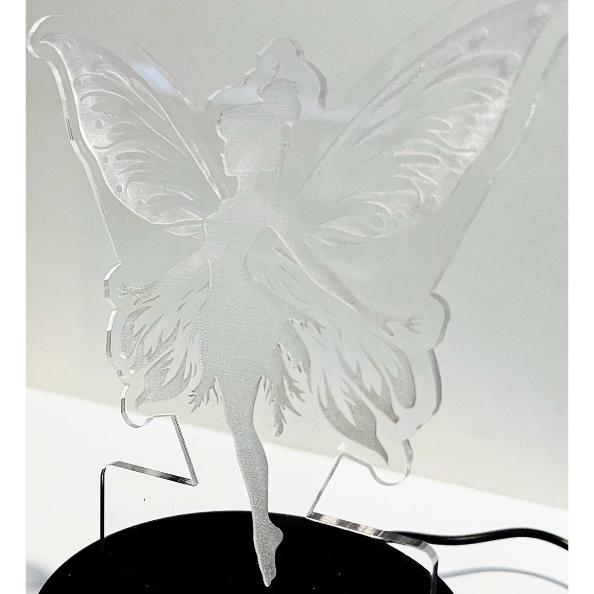 Fairy LED Nightlight #4 with silhouette design on display.