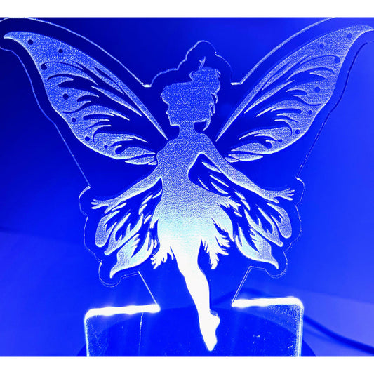 Fairy LED Nightlight #4 glowing with intricate fairy design.