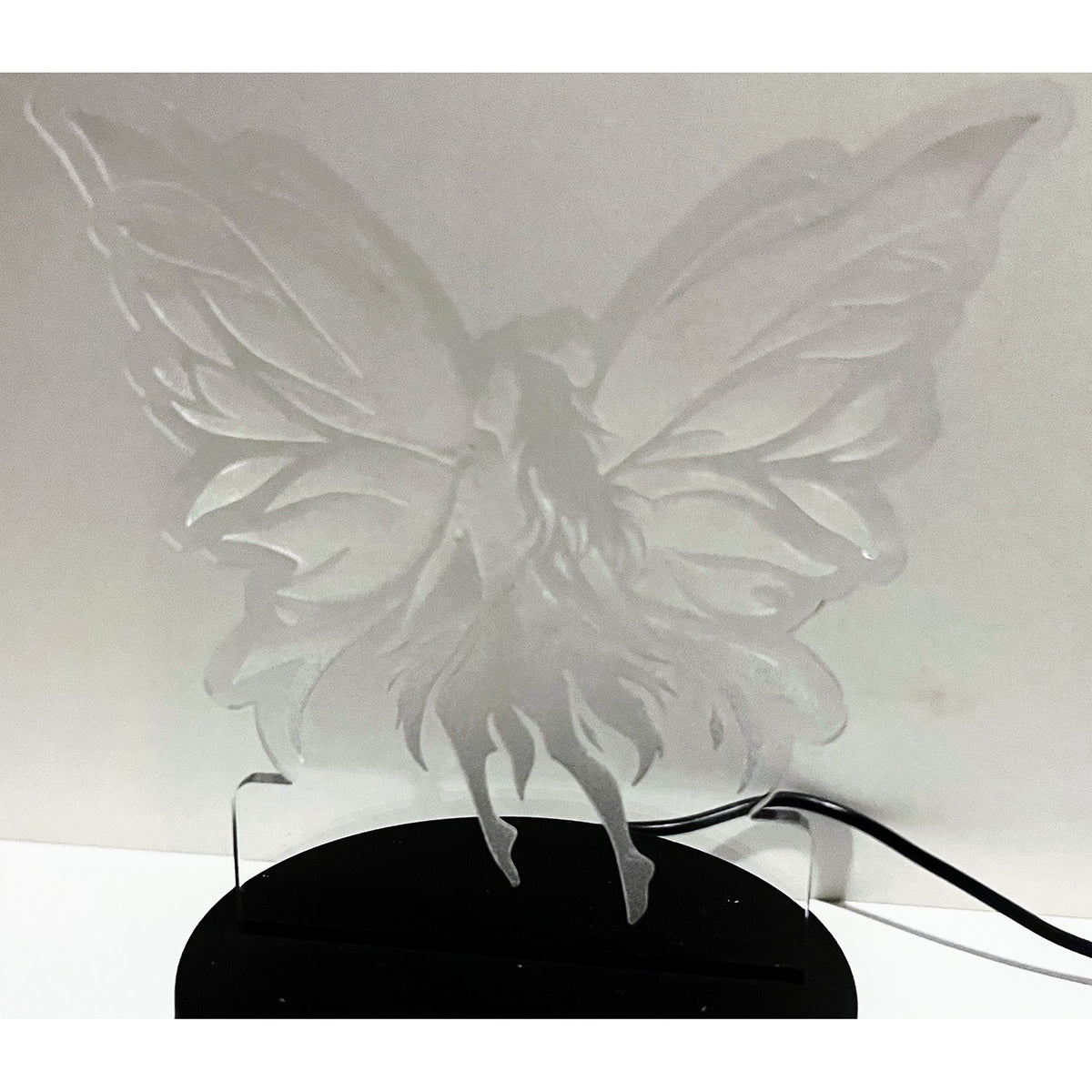 Fairy LED Nightlight featuring a delicate fairy design on a stand.