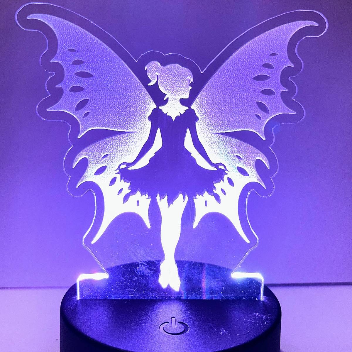 Fairy LED Nightlight # 2 illuminating with purple glow, magical home décor accessory.