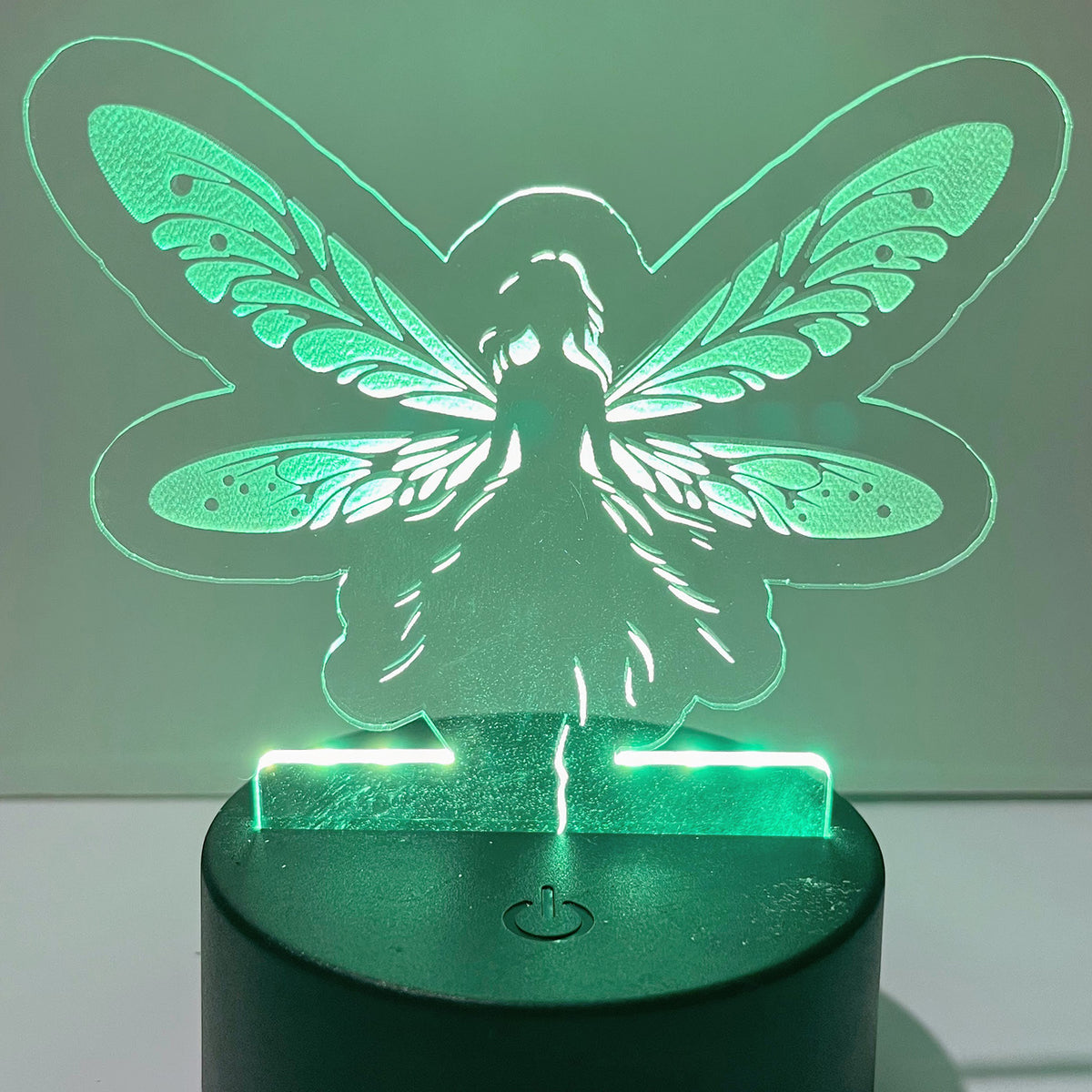 Fairy LED Nightlight # 3 with enchanting design and green glow.