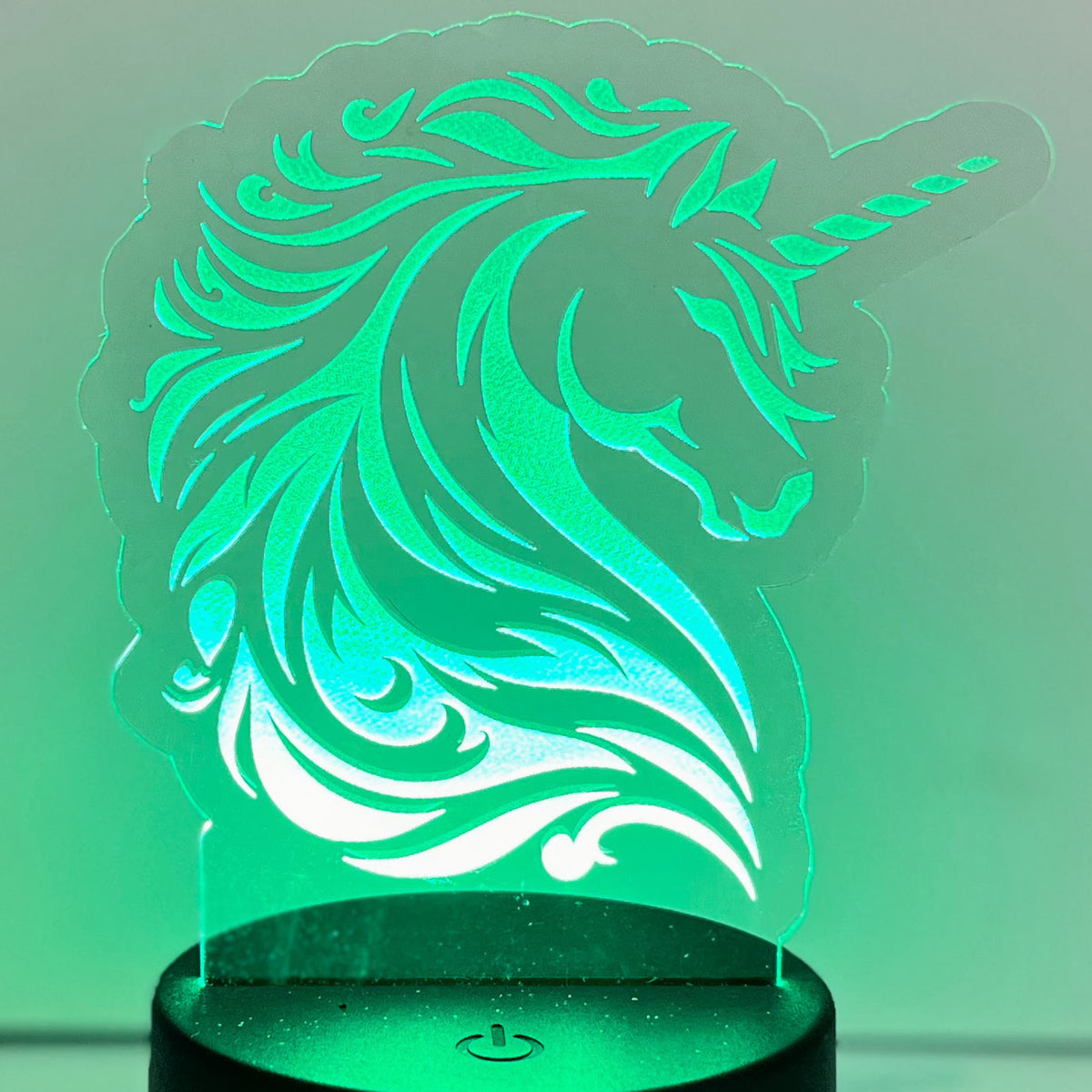 Majestic Unicorn LED Nightlight glowing in soothing green.