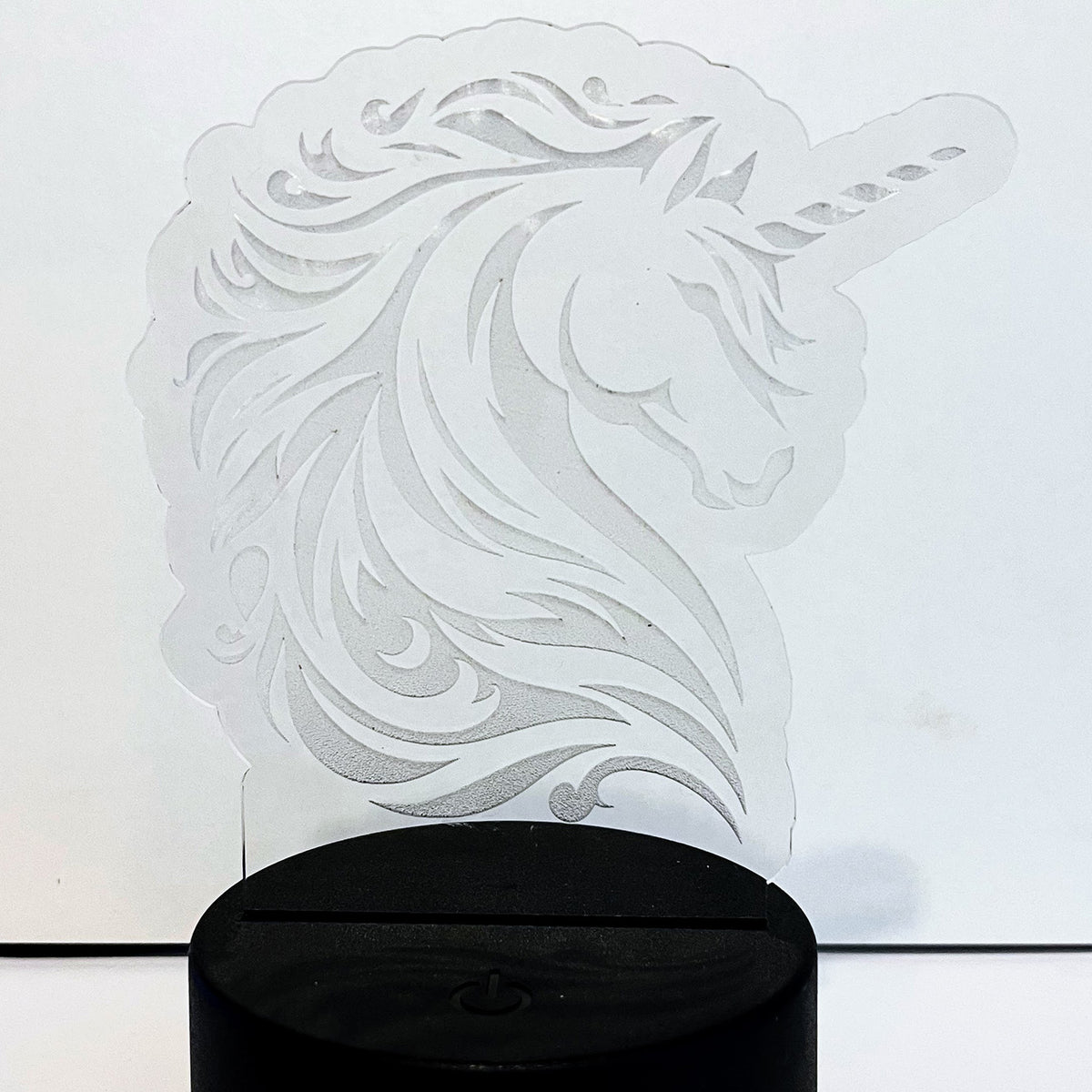 Majestic Unicorn LED Nightlight with intricate design on a black base.