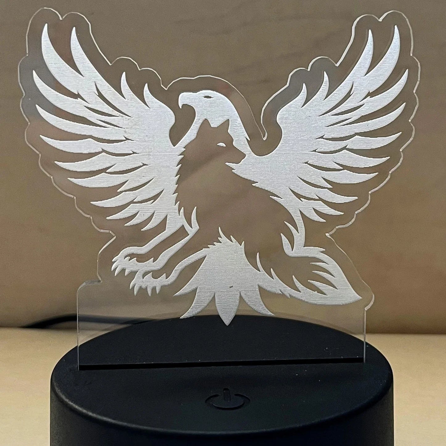 Wolf LED nightlight with eagle and wolf design.